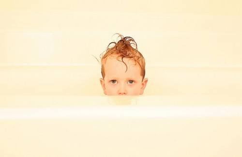 Kid-in-bathtub_-Deep-in-debt_familymwr-e1289382750931