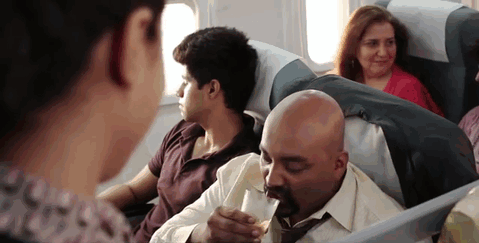 Indian drinking on flight gif